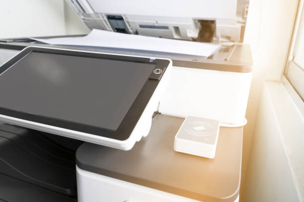 istock copying paper from Photocopier with access control for scanning key card and NFC technology 1029128126