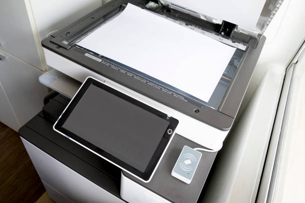 istock copying paper from Photocopier with access control for scanning key card and NFC technology 1029128158