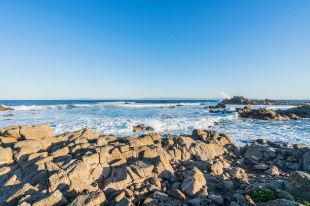 istock sea waves splashing on rock 1029128354