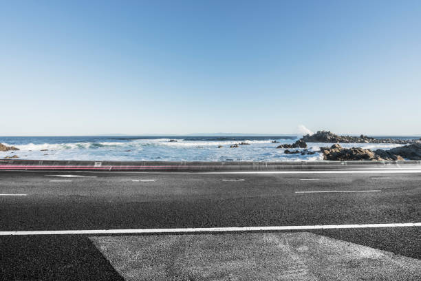 istock tarmac road at coast against sky 1029130080