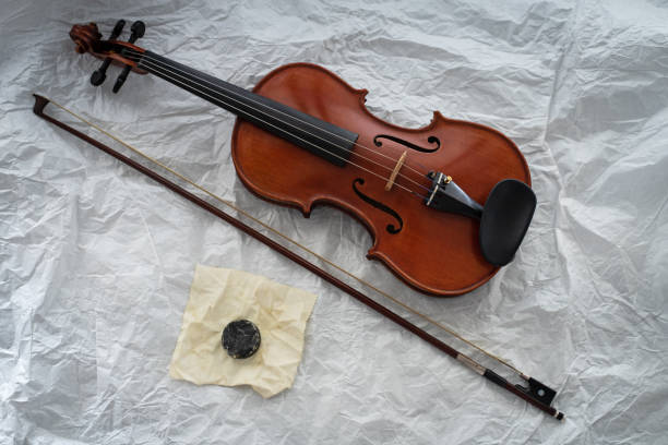 The wooden violin put beside bow and rosin,on background,prepare for practice The wooden violin put beside bow and rosin,on background,prepare for practice rosin stock pictures, royalty-free photos & images