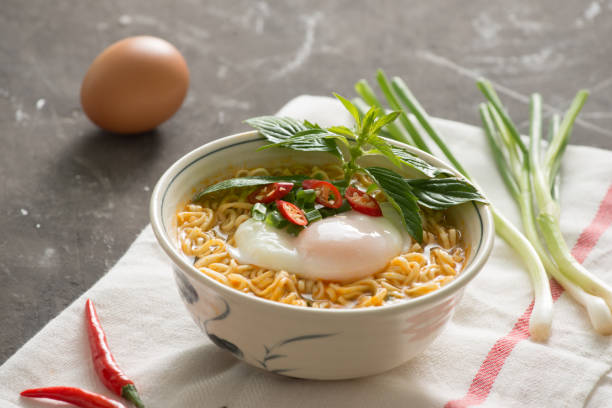 istock Instant noodles soup put egg and vegetables 1029131100