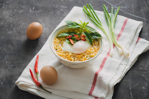 istock Instant noodles soup put egg and vegetables 1029131104