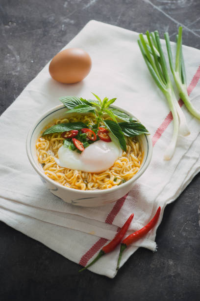 istock Instant noodles soup put egg and vegetables 1029131128