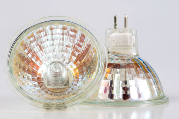 istock Halogen bulb on a white table. Modern interior lighting of apartment buildings. White background. 1029144004