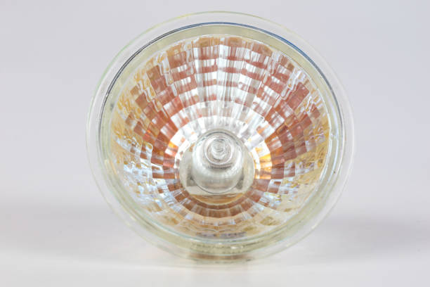 istock Halogen bulb on a white table. Modern interior lighting of apartment buildings. White background. 1029144006