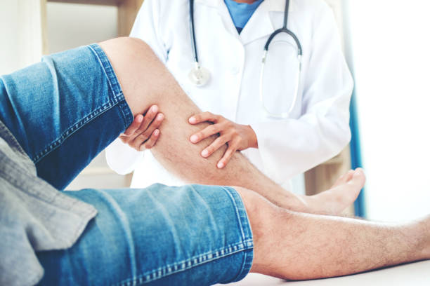 istock Doctor consulting with patient Knee problems Physical therapy concept 1029147022