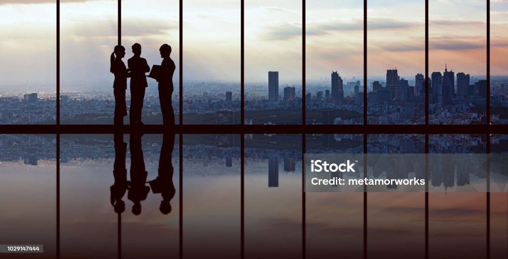 Businesspeople in front of urban cityscape. Business Stock Photo