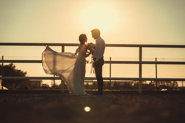 istock Bride and Groom Silhouette 1029152390