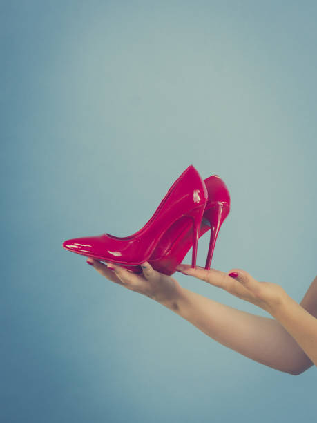 istock Fashion stylist presenting high heels 1029164278