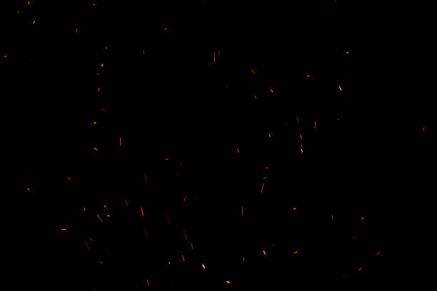 istock bonfire spark in the dark sky in night, shallow focus 1029167216