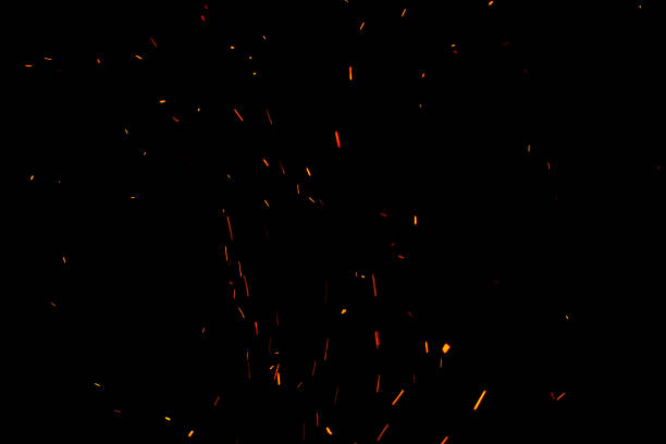 istock bonfire spark in the dark sky in night, shallow focus 1029167220