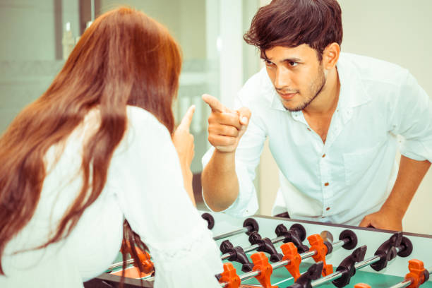 istock Happy couple playing foosball table. 1029172770