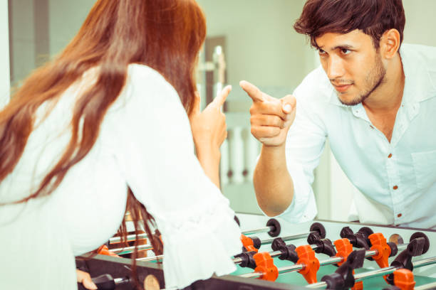 istock Happy couple playing foosball table. 1029172794
