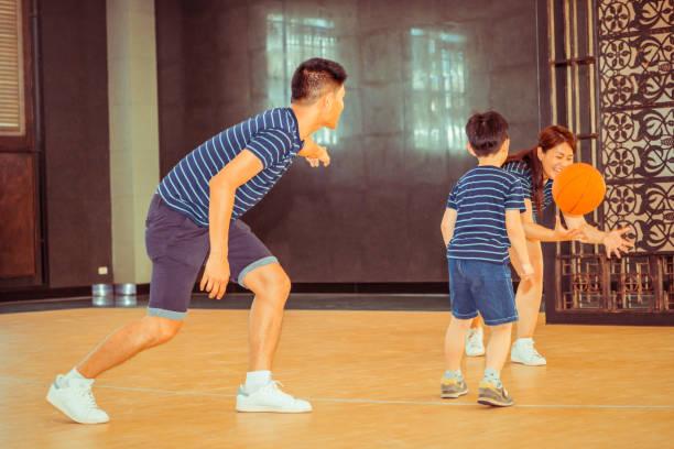 istock Happy family playing basketball. 1029175928