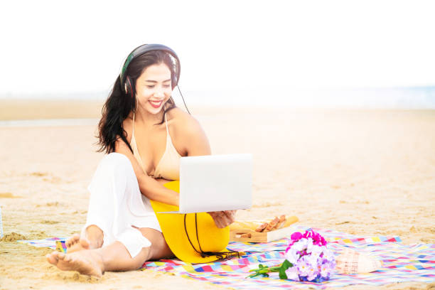 istock Plus size young woman sitting on the beach. 1029176016
