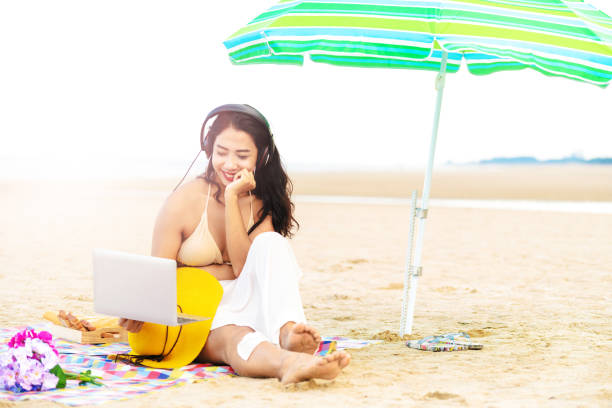 istock Plus size young woman sitting on the beach. 1029176048