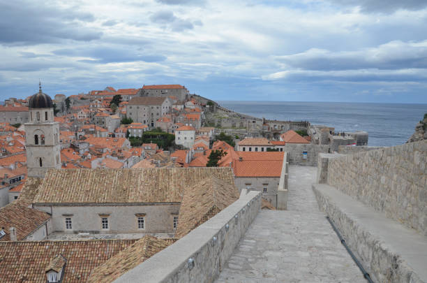 old city of dubrovnik has managed to preserve its gothic, renaissance and baroque churches, monasteries, fortress & fountains. red rooftops are the iconic look of the old city. - warrior eastern europe croatia architecture imagens e fotografias de stock