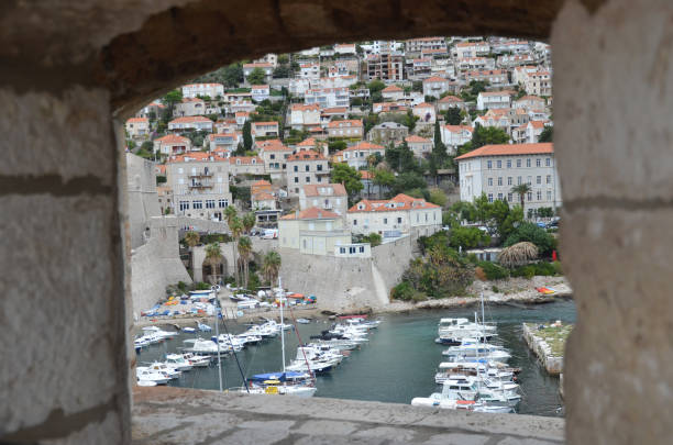 old city of dubrovnik has managed to preserve its gothic, renaissance and baroque churches, monasteries, fortress & fountains. red rooftops are the iconic look of the old city. - warrior eastern europe croatia architecture imagens e fotografias de stock