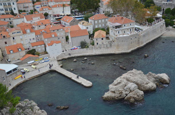 old city of dubrovnik has managed to preserve its gothic, renaissance and baroque churches, monasteries, fortress & fountains. red rooftops are the iconic look of the old city. - warrior eastern europe croatia architecture imagens e fotografias de stock