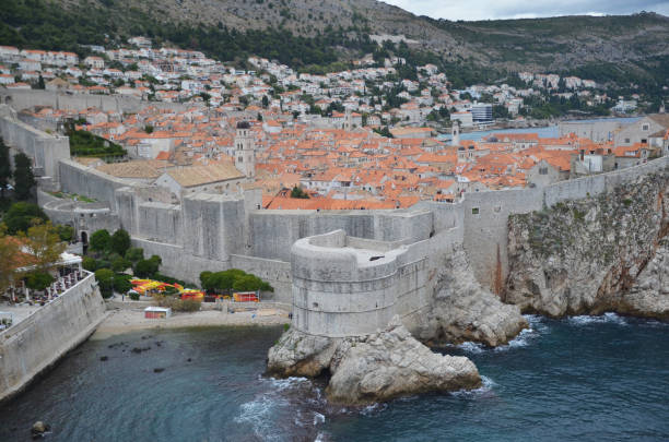 old city of dubrovnik has managed to preserve its gothic, renaissance and baroque churches, monasteries, fortress & fountains. red rooftops are the iconic look of the old city. - warrior eastern europe croatia architecture imagens e fotografias de stock