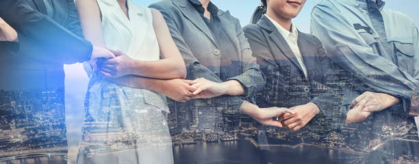 istock Double exposure business people holding hands. 1029182216