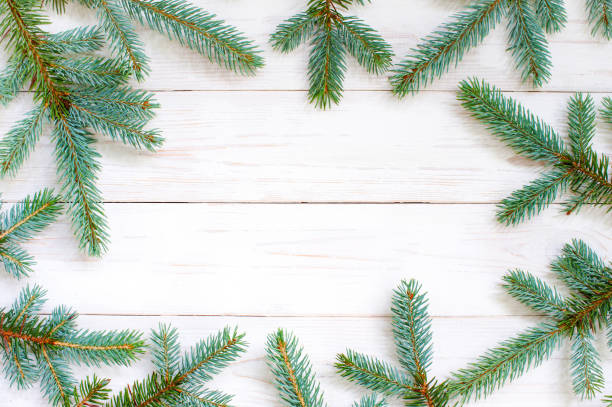 istock Natural white wooden background with spruce brunches 1029182906