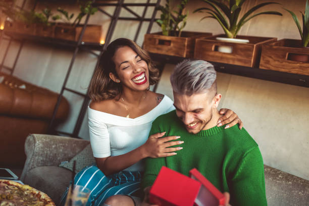istock Man giving gift to his girlfriend in cafe 1029188670