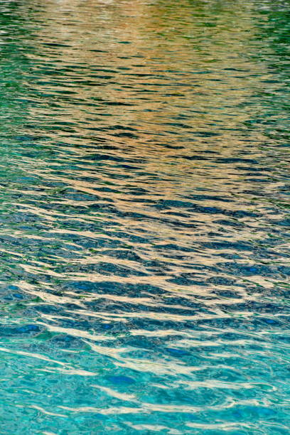 istock Reflecting Turquoise Blue Water Surface With Little Waves 1029194312