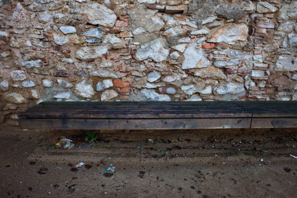 istock Wooden Bench at Medieval Stone Wall 1029197896