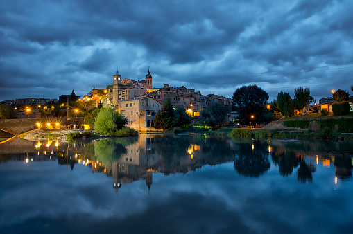 Dark evening in Gironella (Barcelona), a small town with a magnificent pond and old architecture