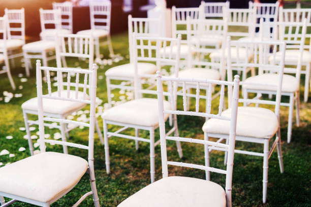 istock White wooden chairs in few rows. Celebration day. 1029200930
