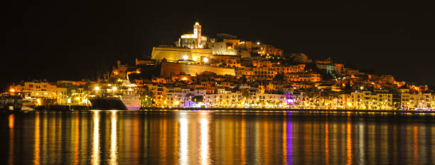 istock Ibiza town, (Eivissa) - at night lights reflected across the harbour. 1029206788