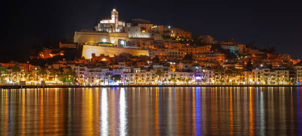 istock Ibiza town, (Eivissa) - at night lights reflected across the harbour. 1029206790