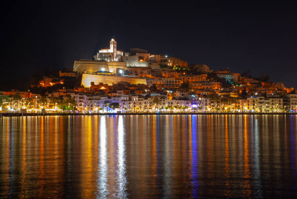 istock Ibiza town, (Eivissa) - at night lights reflected across the harbour. 1029206798