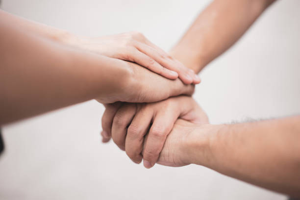 istock Close up teamwork stack of hands together. Togetherness Collaboration Concept 1029214462
