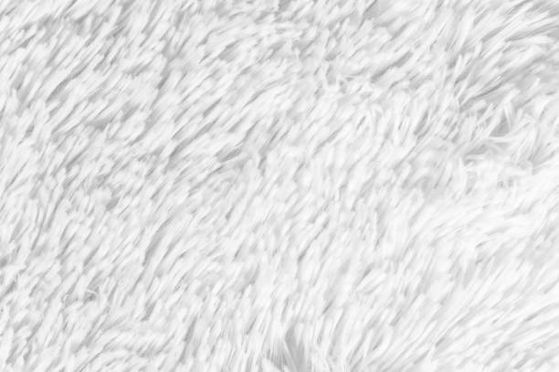 istock Fluffy plaid of polyester with a long heap gray. Comfortable home textiles. Background, texture 1029217668