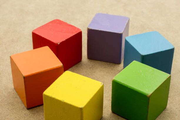 istock Colorful building  blocks on brown background 1029224706