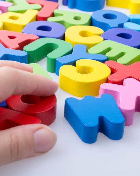 istock Colorful letter blocks scattered randomly on white 1029224726