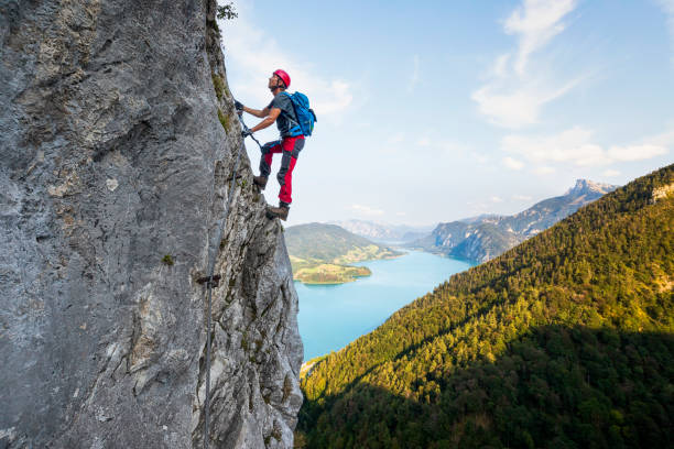 Rock climbing in Alps Mondsee, Austria, Dawn, Via Ferrata, Drachenwand climbing stock pictures, royalty-free photos & images