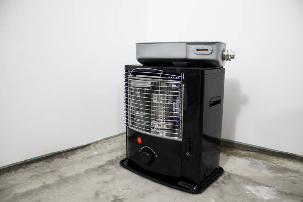 istock Black kerosene heater in a white background composition 1029228566