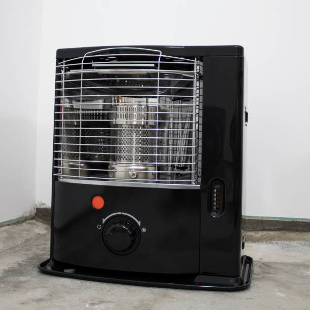 istock Black kerosene heater in a white background composition 1029228574