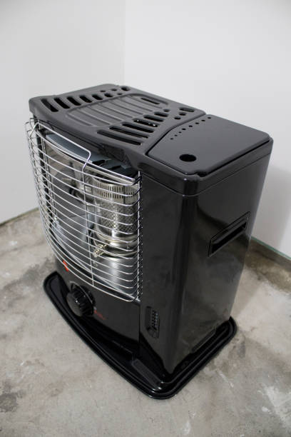 istock Black kerosene heater in a white background composition 1029228584