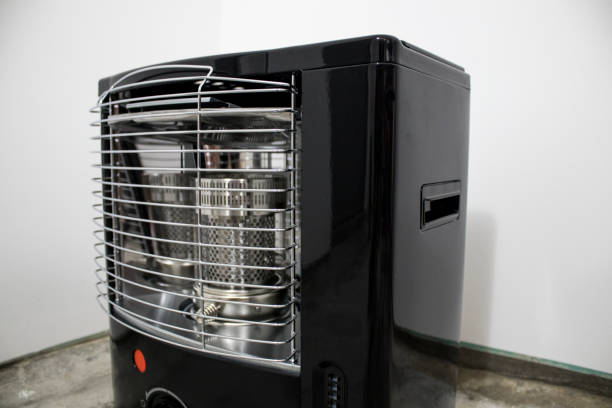 Black kerosene heater in a white background composition