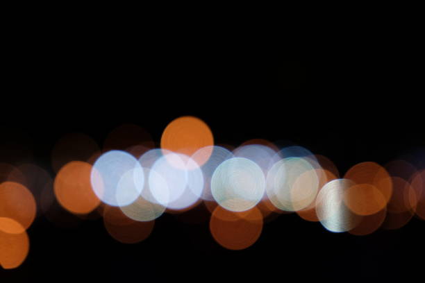 istock Abstract Defocused Lights, Bokeh on Black Background 1029245520