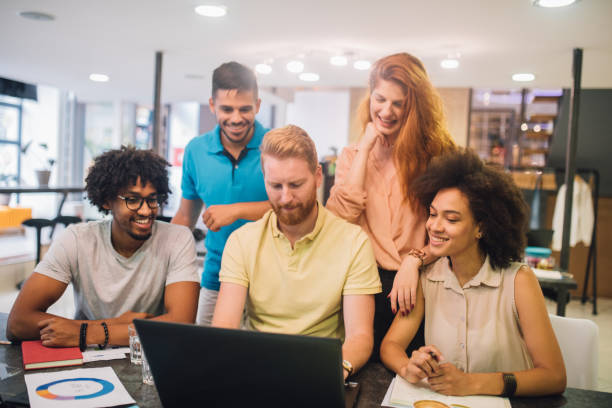 istock Young people working together in an office 1029264874