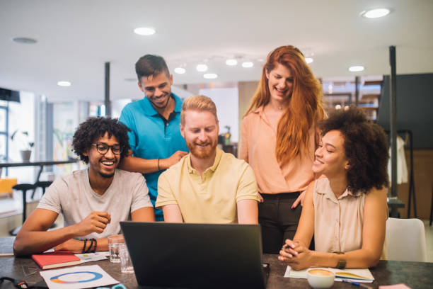 istock Happy young business people working together in an office 1029264946
