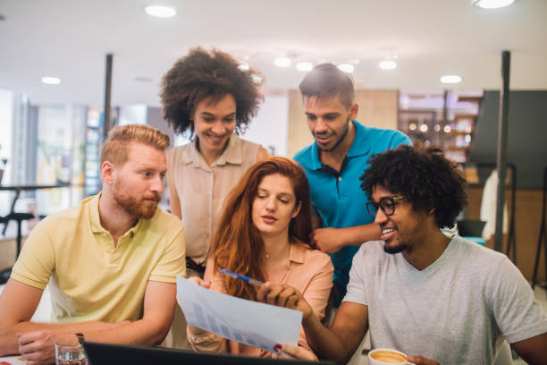 istock Young business people talking about a graph in an office 1029265002