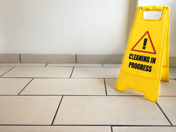 istock Cleaning in progress caution yellow sign on office floor 1029267958
