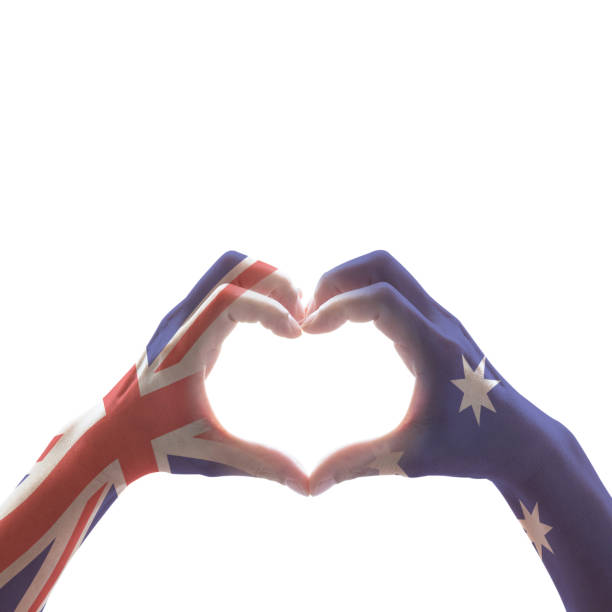 australia national flag  on people hands in heart shape isolated on white background for labour day and national anzac holiday celebration - australia australia day celebration flag imagens e fotografias de stock
